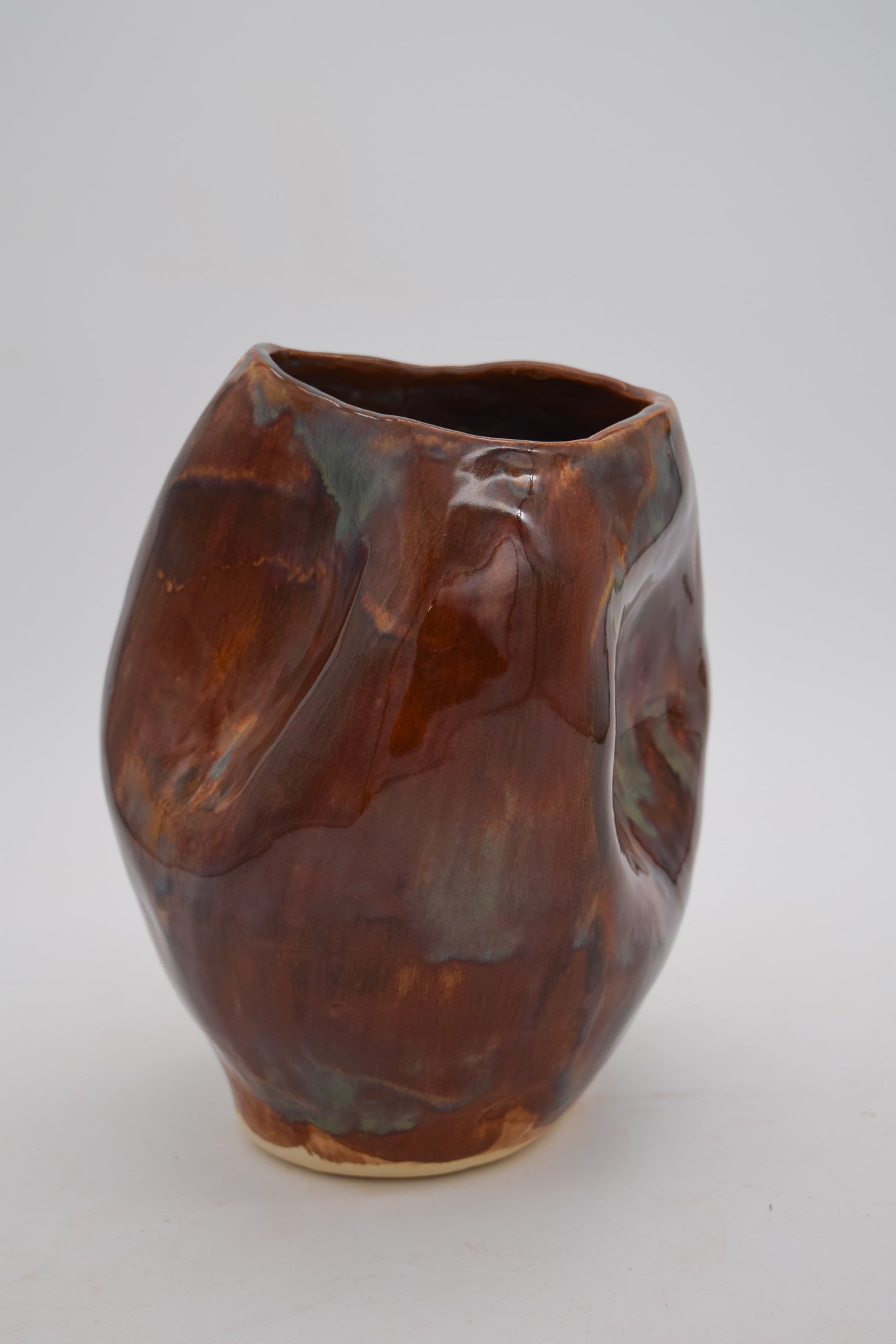 Brown ceramic vase on a white background